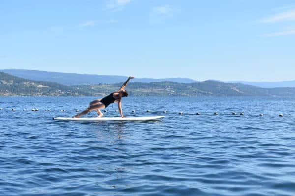 Paddle board yoga during my yoga retreat. That yoga retreat was the best personal development. I'm attempting the wild thing pose in this picture.