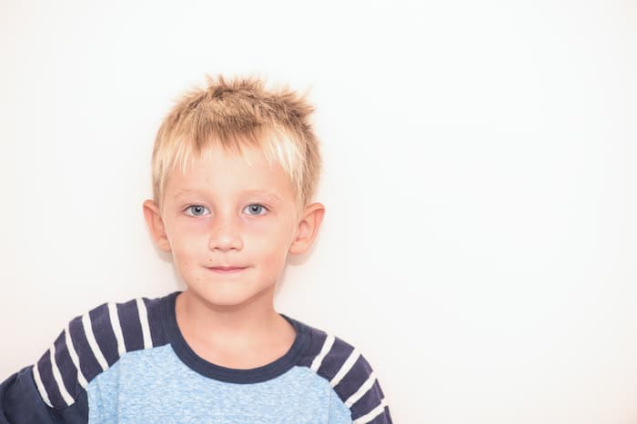 Photo of blond boy grinning