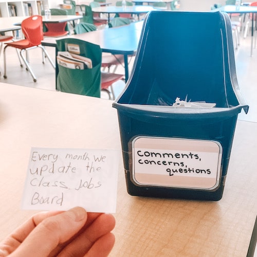 Comments, concerns & questions box in classroom with a suggestion from a student that reads "every month we update the class jobs board"