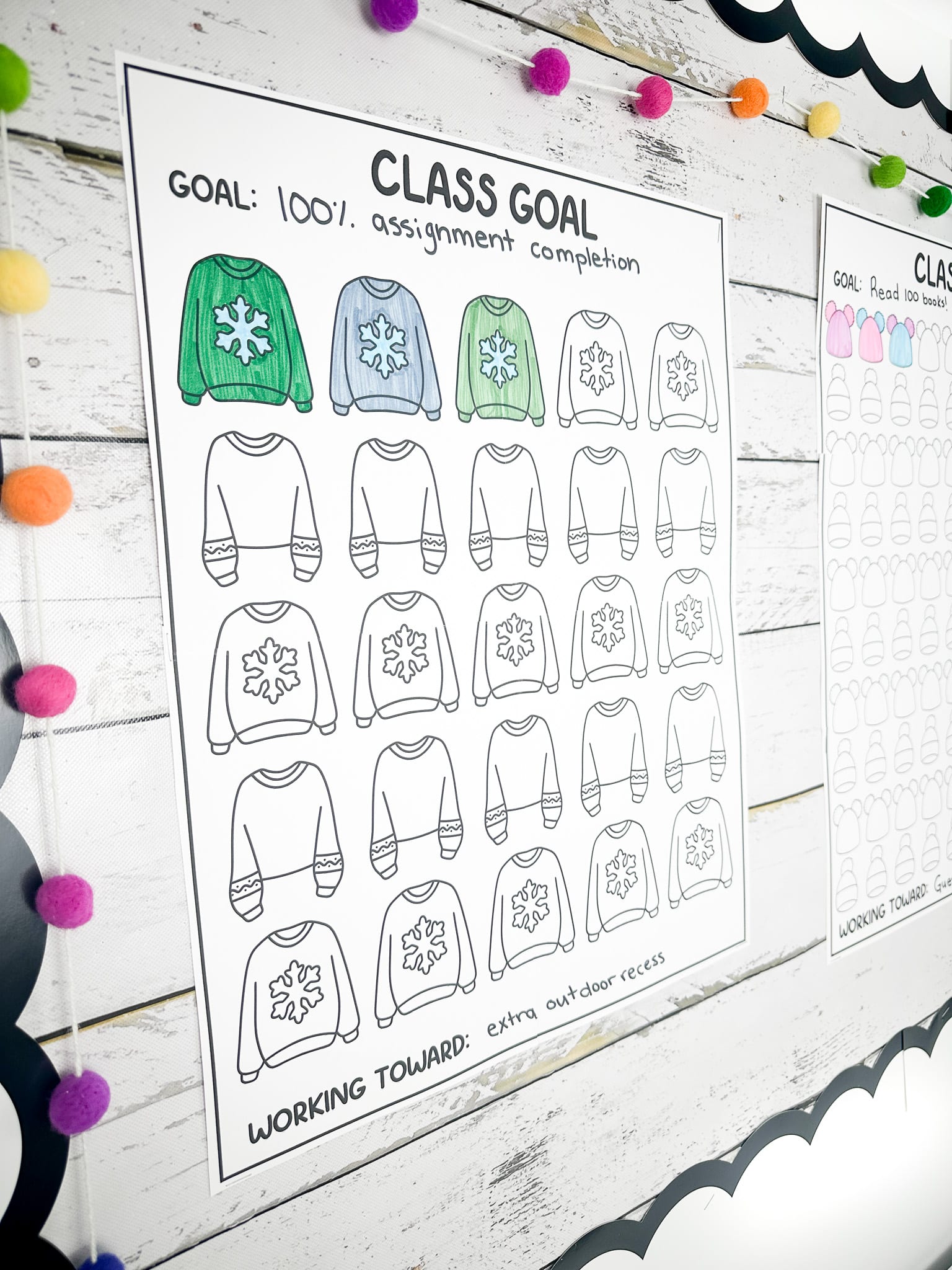 Class goals poster with the goal to have 100% assignment completion with three of the twenty five sweaters coloured in and working toward the goal of extra outdoor recess