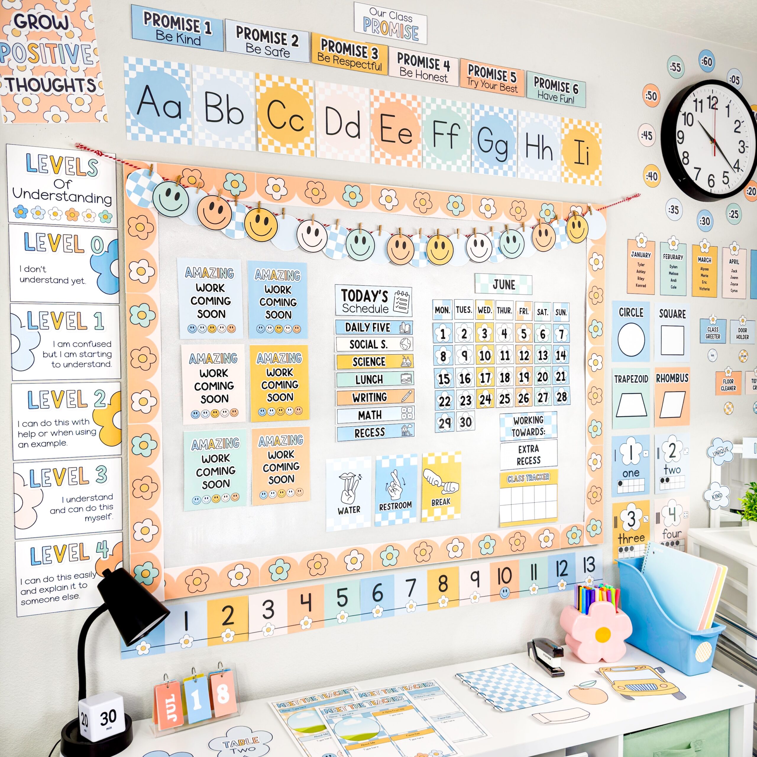 photo of boho classroom decor showing a ton of resources like boho clock labels, schedule, levels of understanding posters, alphabet posters, calendar, number line, hand signals, and more