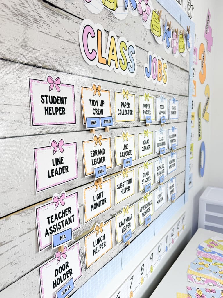 Photo showing classroom jobs display in a classroom with bright classroom job tags and student names