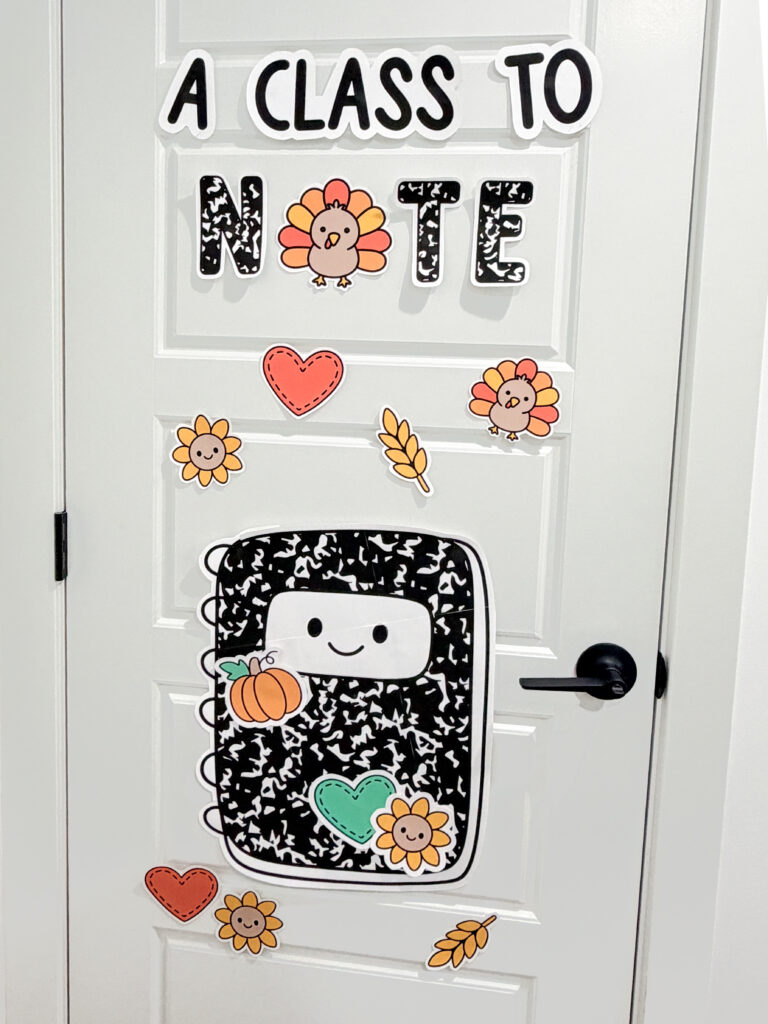 Fall composition notebook classroom decor with seasonal stickers and autumn bulletin board pieces